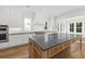 Bright open kitchen with an oversized center island, stainless appliances, and modern fixtures at 3893 Summerton St, Mount Pleasant, SC 29466