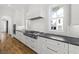 Modern open concept kitchen with stainless steel appliances and a white brick backsplash at 3893 Summerton St, Mount Pleasant, SC 29466