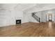 Open-concept living room with a fireplace, custom cabinetry, coffered ceiling and hardwood floors at 3893 Summerton St, Mount Pleasant, SC 29466