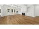 Bright living room boasts hardwood floors, built-in bookshelves, fireplace, coffered ceiling, and access to the outdoor deck at 3893 Summerton St, Mount Pleasant, SC 29466