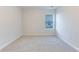 Neutral bedroom with plush carpet and a window at 462 Fox Sparrow Ct, Summerville, SC 29486
