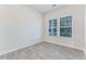 Bedroom featuring natural light from two windows and stylish flooring, creating a welcoming space at 462 Fox Sparrow Ct, Summerville, SC 29486