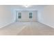 Spacious bedroom with neutral carpet and two bright windows at 462 Fox Sparrow Ct, Summerville, SC 29486