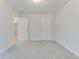 Light-filled bedroom with plush carpet and white doors at 462 Fox Sparrow Ct, Summerville, SC 29486