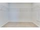 Walk-in closet with custom shelving that maximizes space and organization in the bedroom at 462 Fox Sparrow Ct, Summerville, SC 29486