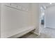 Clean entryway featuring a bench with coat hooks and wood-look floors at 462 Fox Sparrow Ct, Summerville, SC 29486