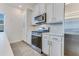 Bright kitchen with stainless steel appliances, white cabinets and range at 462 Fox Sparrow Ct, Summerville, SC 29486