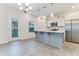 Modern kitchen with stainless steel appliances, gray island, and white cabinetry at 462 Fox Sparrow Ct, Summerville, SC 29486