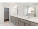 Bathroom featuring double vanity, undermount sinks, and a separate shower room at 468 Cadbury Loop, Summerville, SC 29486