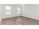 Bright bedroom with large windows and wood-look flooring at 468 Cadbury Loop, Summerville, SC 29486