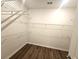 Spacious walk-in closet with wire shelving and dark laminate flooring at 468 Cadbury Loop, Summerville, SC 29486