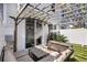 Relaxing back patio with modern seating, a pergola, and outdoor lighting at 4852 Rocking Porch Ln, Summerville, SC 29485