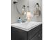 Bathroom vanity with a solid surface sink and towel accessories at 4852 Rocking Porch Ln, Summerville, SC 29485