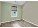 Cozy bedroom with hardwood style flooring and a window at 4852 Rocking Porch Ln, Summerville, SC 29485