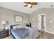 Comfortable bedroom featuring a wood ceiling fan, neutral paint, and luxury vinyl floors at 4852 Rocking Porch Ln, Summerville, SC 29485