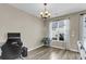 Bright dining room with large windows and hardwood floors, perfect for entertaining at 4852 Rocking Porch Ln, Summerville, SC 29485