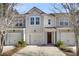 Charming townhome with a well-maintained lawn and attached garage, offering a welcoming curb appeal at 4852 Rocking Porch Ln, Summerville, SC 29485