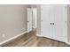 Hallway featuring luxury vinyl floors and bright white doors at 4852 Rocking Porch Ln, Summerville, SC 29485