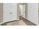 Hallway with luxury vinyl plank flooring and bright white doors at 4852 Rocking Porch Ln, Summerville, SC 29485