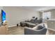 Comfortable living room features a sectional sofa and large TV at 4852 Rocking Porch Ln, Summerville, SC 29485