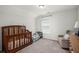 A welcoming Bedroom with a crib, a small toddler bed, and comfortable seating at 546 Alderly Dr, Moncks Corner, SC 29461