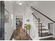 Welcoming entryway featuring hardwood floors, staircase, and view to the kitchen at 546 Alderly Dr, Moncks Corner, SC 29461