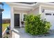 Close-up of the front door and landscaping, highlighting the home's curb appeal at 546 Alderly Dr, Moncks Corner, SC 29461