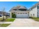 Charming single-Gathering home featuring a two-car garage and well-maintained landscaping at 546 Alderly Dr, Moncks Corner, SC 29461
