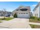 Inviting single-Gathering home featuring a well-manicured front yard and attached two-car garage at 546 Alderly Dr, Moncks Corner, SC 29461