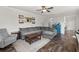 Inviting living room with a comfortable gray sectional, ceiling fan, and views into the entry at 546 Alderly Dr, Moncks Corner, SC 29461