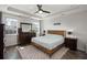 Comfortable main bedroom featuring a tray ceiling, a ceiling fan, and lots of natural light at 546 Alderly Dr, Moncks Corner, SC 29461