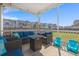 Cozy screened-in patio with comfortable seating, lighting, and views of the neighborhood at 546 Alderly Dr, Moncks Corner, SC 29461