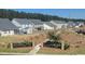 Neighborhood backyards with fences, lush grass, and mature trees, offering privacy and space at 587 Crossland Dr, Moncks Corner, SC 29461