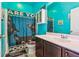 Bathroom featuring bright blue walls, a vanity sink, and a toilet with a unique cat-themed shower curtain at 587 Crossland Dr, Moncks Corner, SC 29461