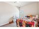 Delightful bedroom with unique cat-themed bedding, a vanity, and a bright window at 587 Crossland Dr, Moncks Corner, SC 29461