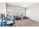 Spacious room with multiple windows, neutral carpet, and walk out balcony, perfect for a home office or studio at 587 Crossland Dr, Moncks Corner, SC 29461