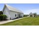 Community clubhouse and park featuring a white structure with a well-maintained lawn and covered picnic area at 587 Crossland Dr, Moncks Corner, SC 29461