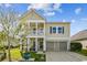 Inviting home featuring a double porch, an attached garage, and attractive siding at 587 Crossland Dr, Moncks Corner, SC 29461