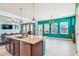 Bright kitchen featuring a large island with stainless steel appliances and an adjacent dining area at 587 Crossland Dr, Moncks Corner, SC 29461