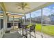 Inviting screened patio with outdoor seating, providing a cozy and shaded space for relaxation at 587 Crossland Dr, Moncks Corner, SC 29461