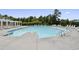 Large community pool surrounded by lounge chairs and greenery, perfect for summer relaxation at 587 Crossland Dr, Moncks Corner, SC 29461