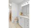 Well-lit bathroom featuring a white vanity, neutral decor, and tiled flooring at 679 Kent St, Mount Pleasant, SC 29464