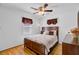 Cozy bedroom featuring hardwood floors, a ceiling fan, and natural light from the windows at 679 Kent St, Mount Pleasant, SC 29464