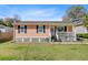 Charming one-story home with an inviting front porch and well-maintained lawn at 679 Kent St, Mount Pleasant, SC 29464