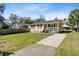 Inviting one-story house with a well-manicured lawn and a convenient driveway at 679 Kent St, Mount Pleasant, SC 29464