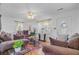 Bright living room with hardwood floors, a ceiling fan, and lots of natural light at 679 Kent St, Mount Pleasant, SC 29464