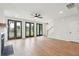 Spacious living area features wood floors, fireplace and multiple doors to outdoor spaces, and stairway to the upper floor at 742 Minton Rd, Charleston, SC 29412