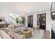 Inviting living room showcasing stylish furnishings, a cozy fireplace, and ample natural light through the French doors at 742 Minton Rd, Charleston, SC 29412