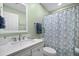 Bathroom featuring a single vanity, and shower with patterned shower curtain at 9080 Delancey Cir, North Charleston, SC 29406