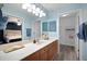 Large bathroom with vanity, framed mirror and view into the bedroom and closet at 9080 Delancey Cir, North Charleston, SC 29406